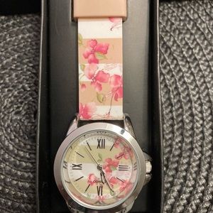 Avon women’s watch. Pretty Floral stripe watch. New, never used.